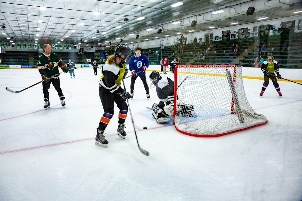 A hockey player trying to score a goal