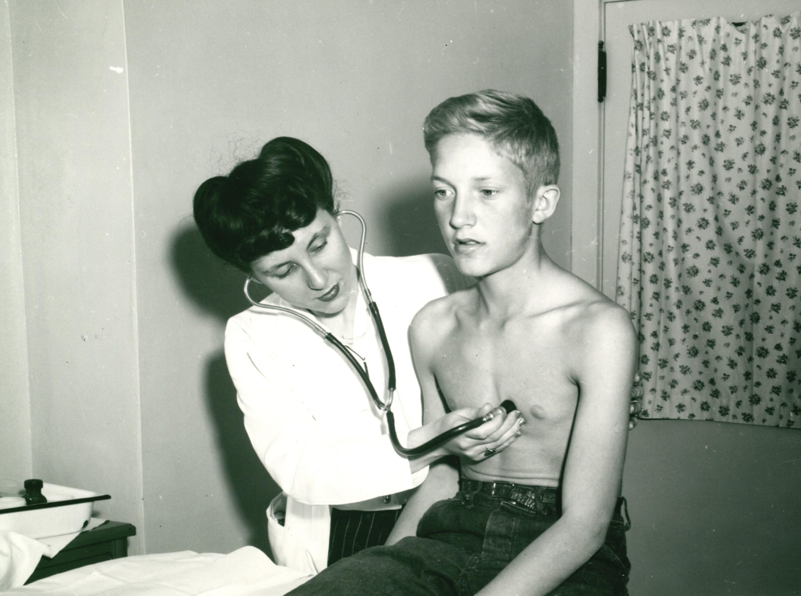 Children's Hospital doctor examining a patient, circa 1940.