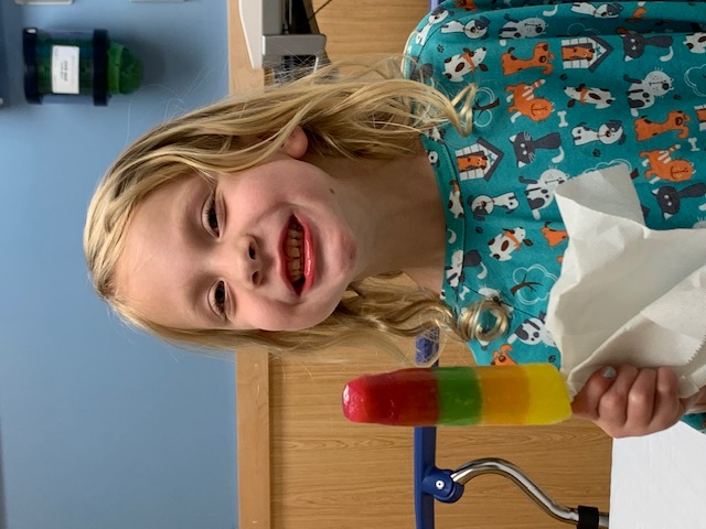 Callie eating a popsicle after having her tonsils removed