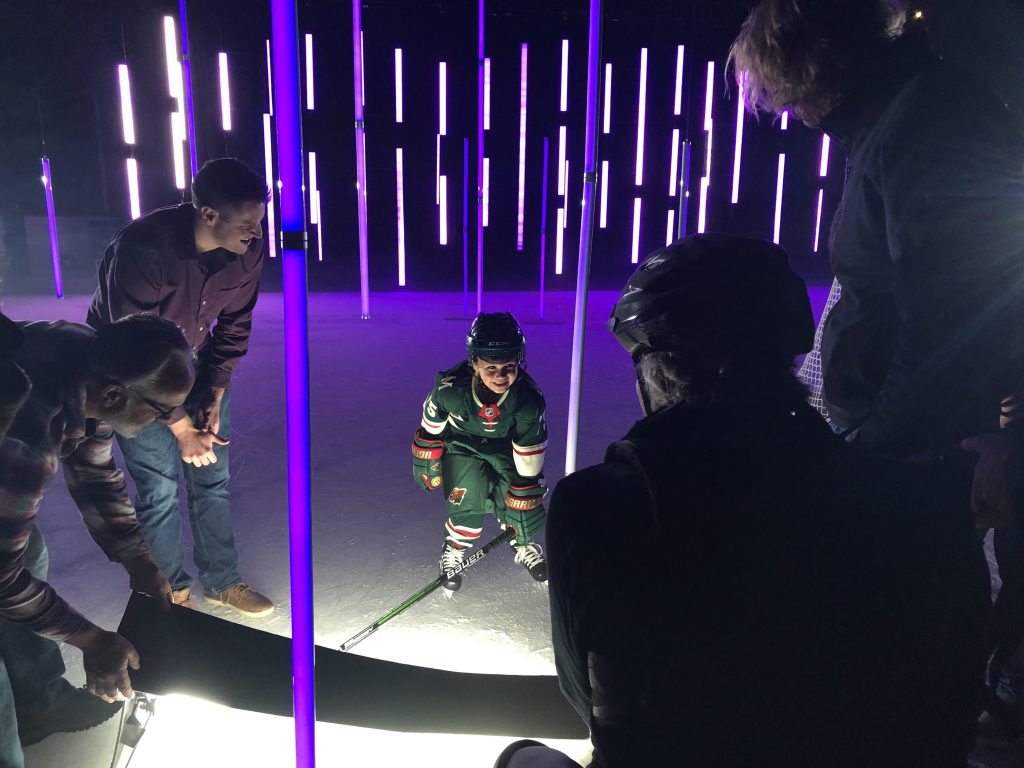 Liam dressed in Minnesota Wild gear shooting the video