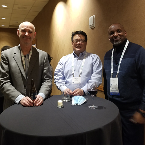 Three attendees networking