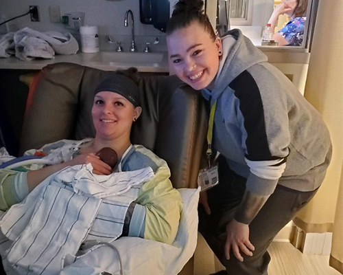 Sierra and Courtney using kangaroo care for their two baby daughters in the NICU.