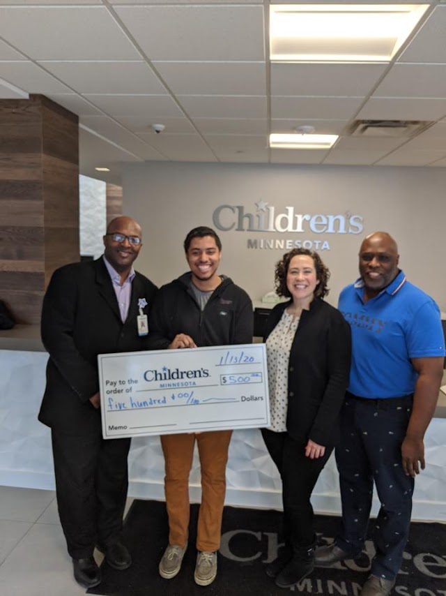 JonWalter presenting his check to Children's Minnesota