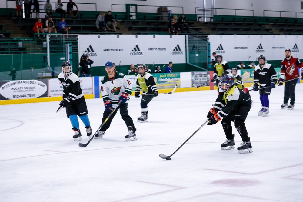 A group of hockey players skating