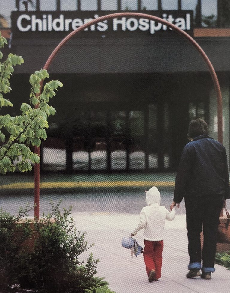 A child and adult walking to the Children's Hospital of St. Paul in the 1980s.
