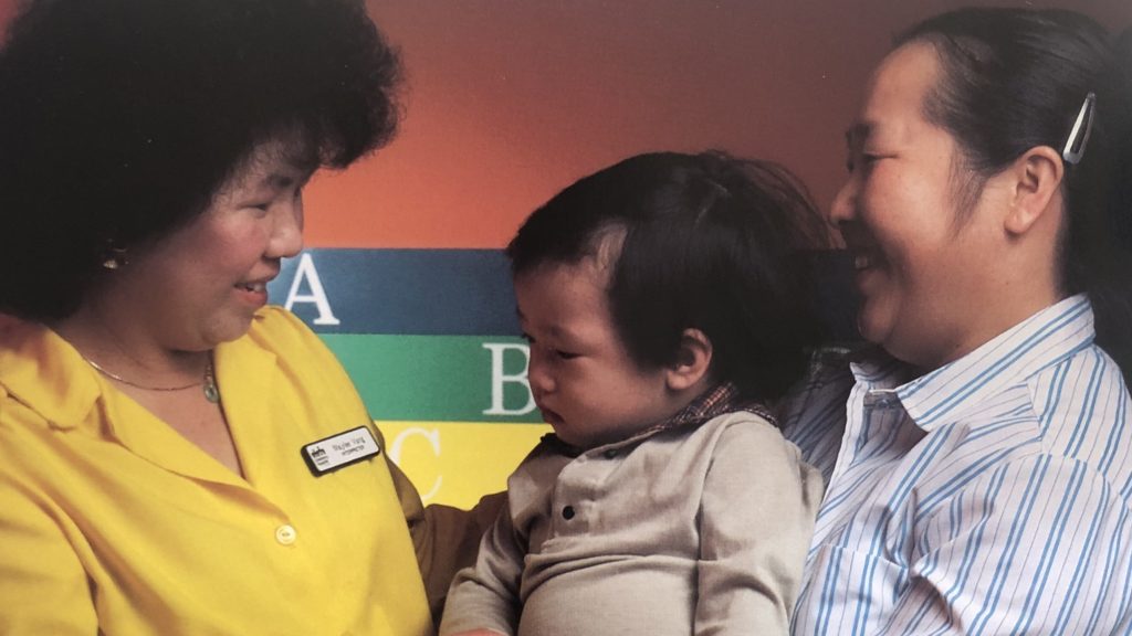 1980s photo of two women with a baby.