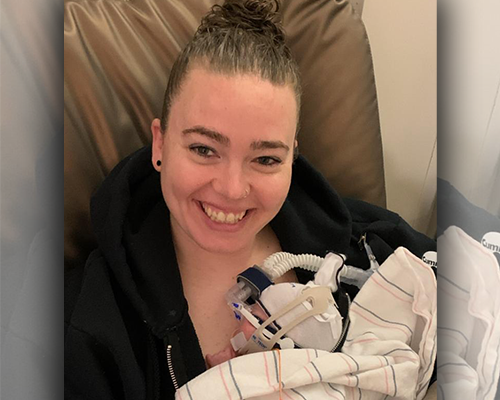 Sierra and Courtney using kangaroo care for their two baby daughters in the NICU