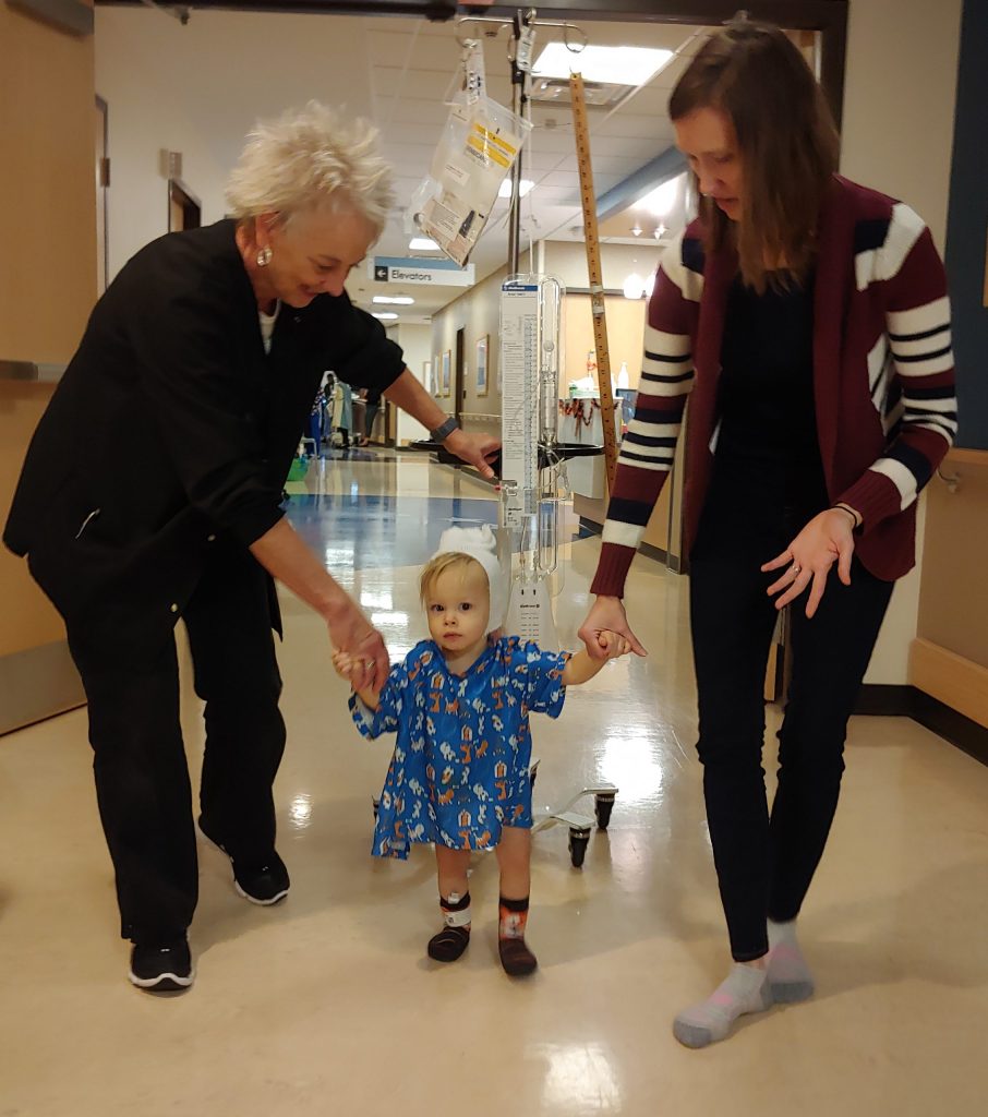 Camille walking the hallway in the hospital