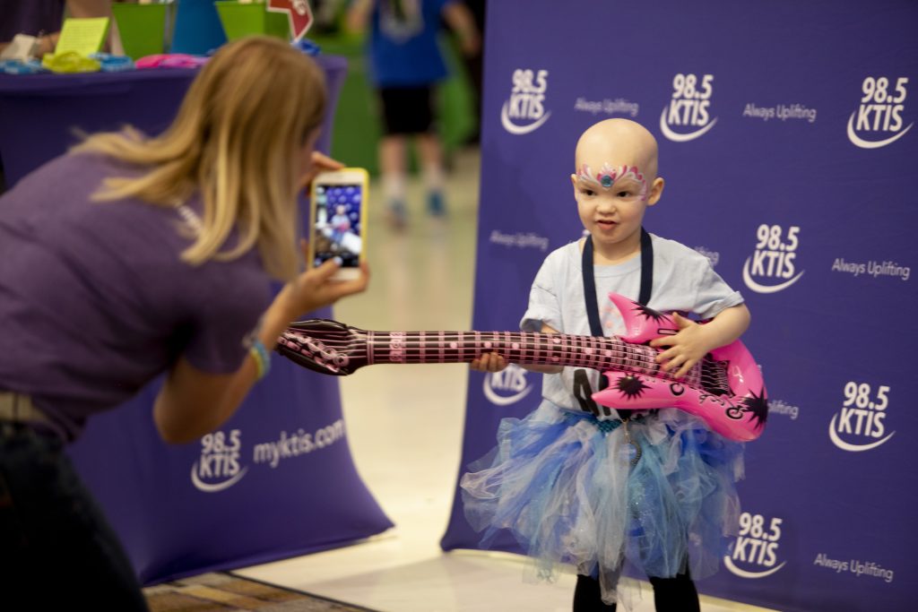 Child playing guitar