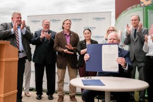 Gov. Walz holding signed mental health legislation bill