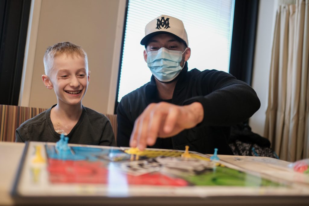 Carlos Correa playing a game with a Children's Minnesota patient