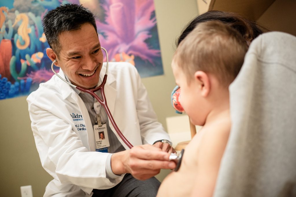 Cardiovascular doctor listening to patient's heart.