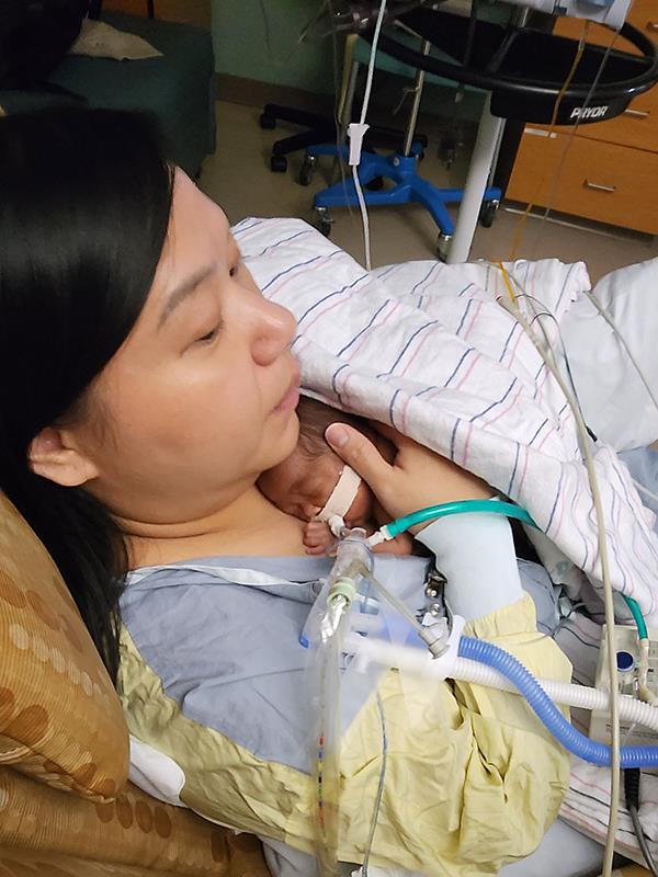 Mom holds baby Gracelyn skin to skin