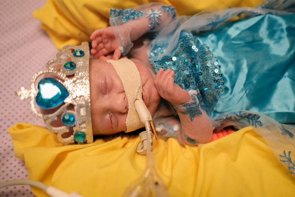 NICU baby dressed up as a princess for Halloween