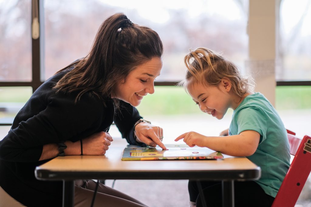 Chloe and her therapist, Erin Diedrich, OTR/L