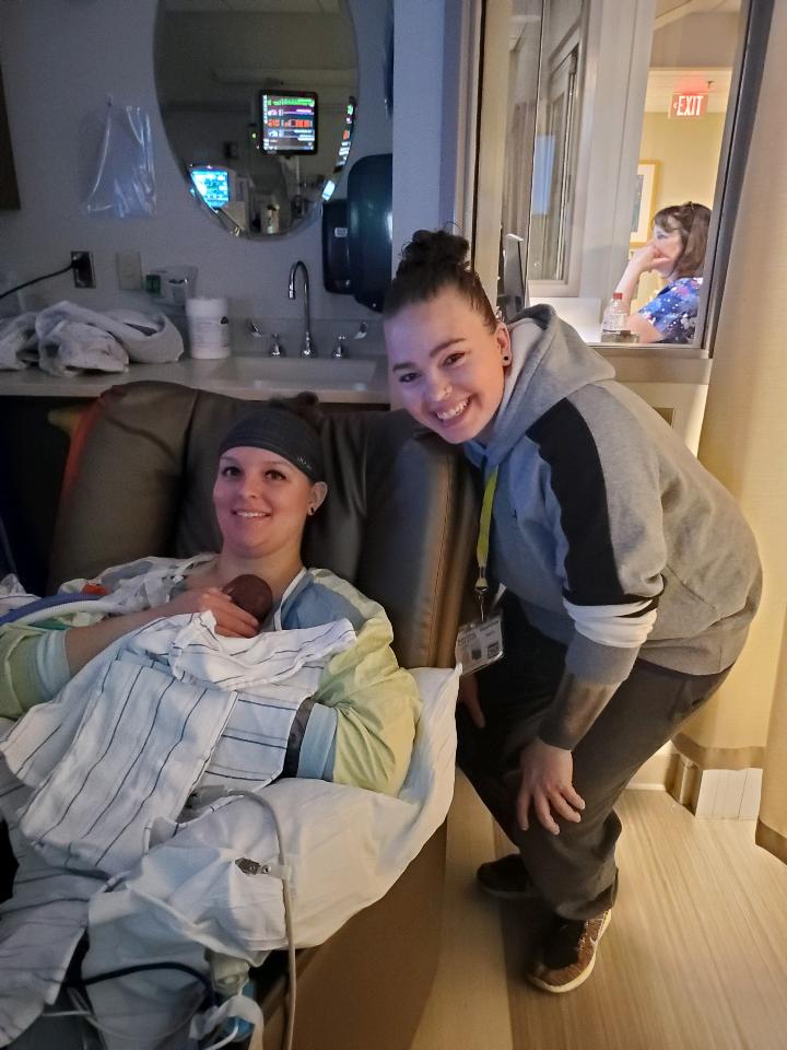 Sierra and Courtney using kangaroo care for their two baby daughters in the NICU