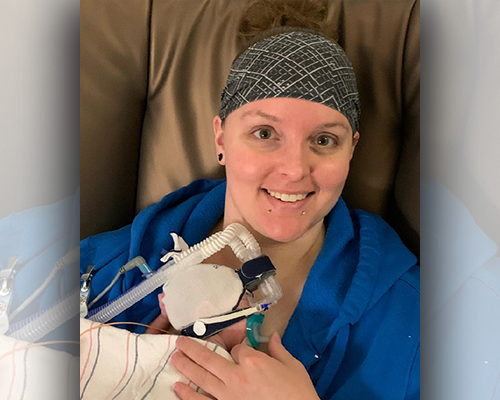 Sierra and Courtney using kangaroo care for their two baby daughters in the NICU