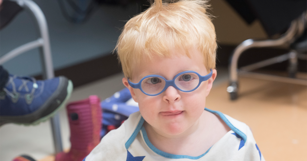 Little boy in a doctors appointment with glasses on