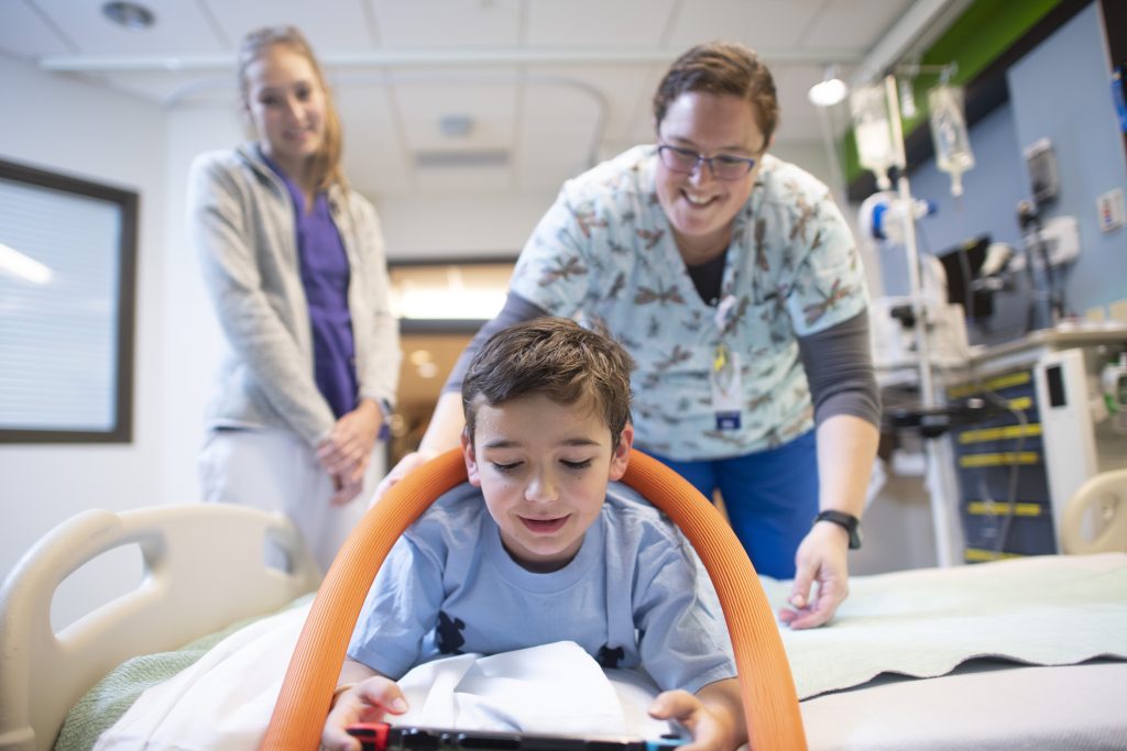 Two nurses use the autism toolkit/sensory toolkit with a patient|Two nurses use the autism toolkit/sensory toolkit with a patient|