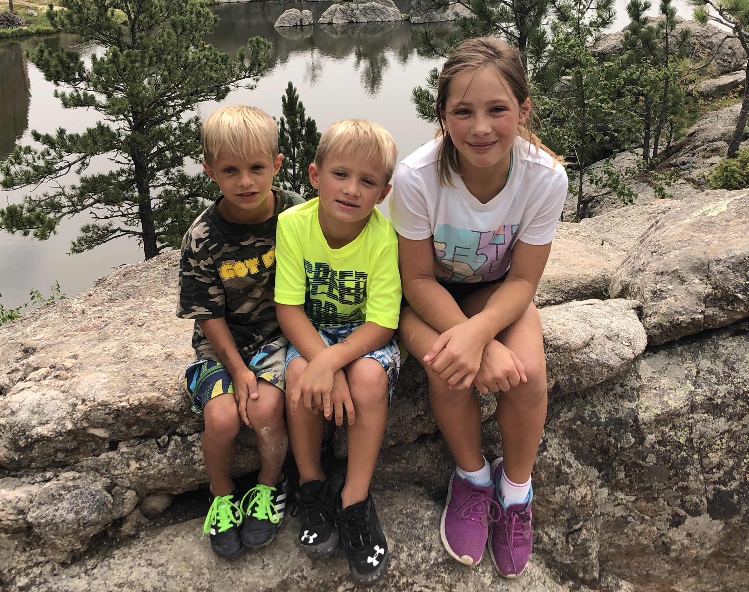 Nicole and her siblings outside on a hike
