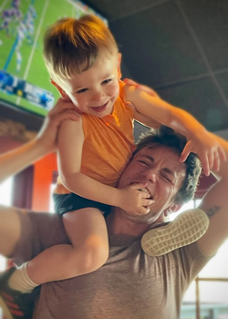 Abe and child on shoulders
