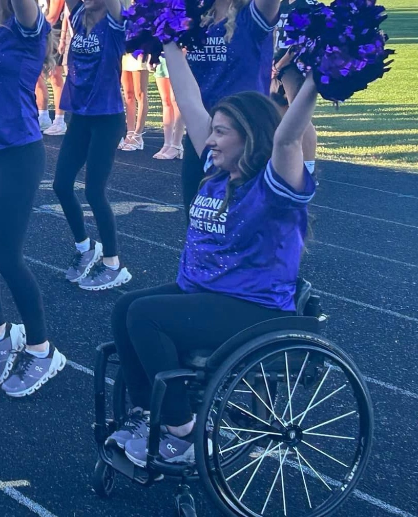 Kaili dancing at a school game