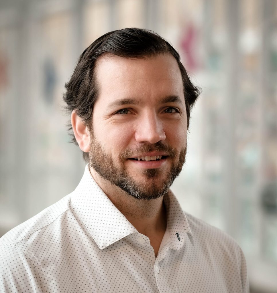 Headshot of Adam Putschoegl, DO