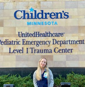 Ari Elfenbein standing outside Children's Minnesota clinic