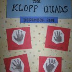 Handprints on pieces of paper from each of the Klopp Quads