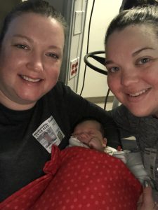 Katie and Betsy holding William after he was born.