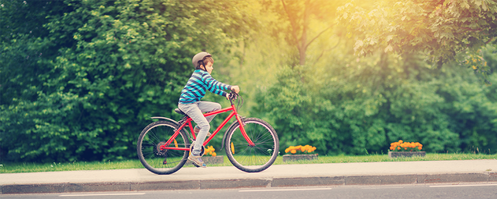 a kid riding a bike