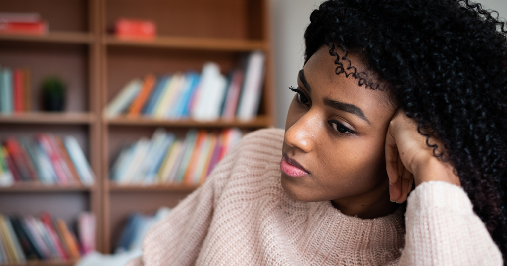 Young black teenager feeling sad