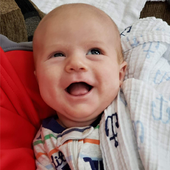 Blake smiling as a baby