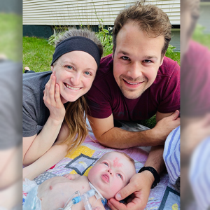 Esther and her parents laying outside
