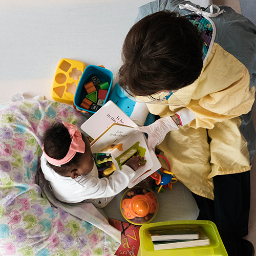 Employee reading to patient