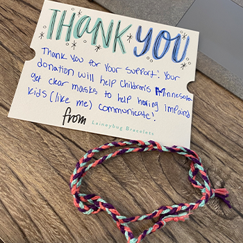 A Laineybug Bracelet with a personal thank you note from Lainey
