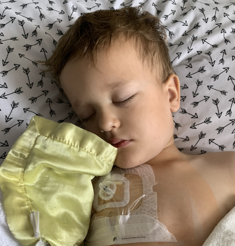 Breckon with his eyes closed in a hospital bed.