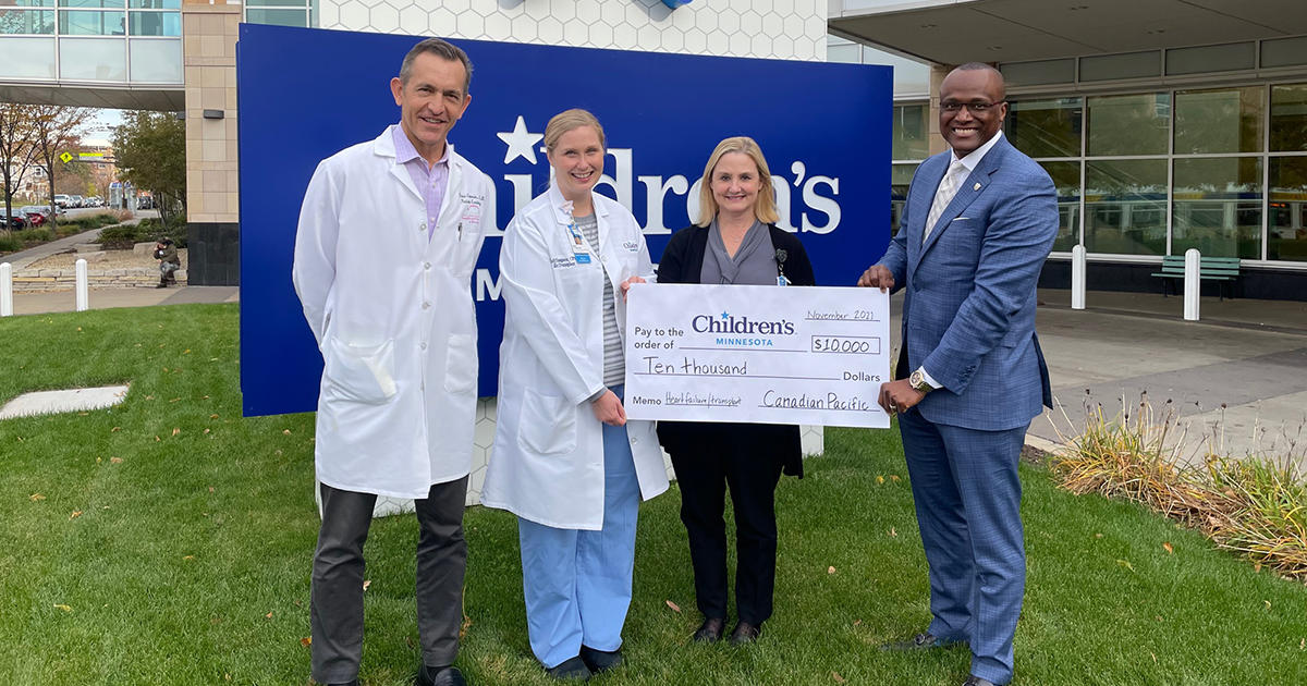 Canadian Pacific employees with a big check outside Children's Minnesota with our employees