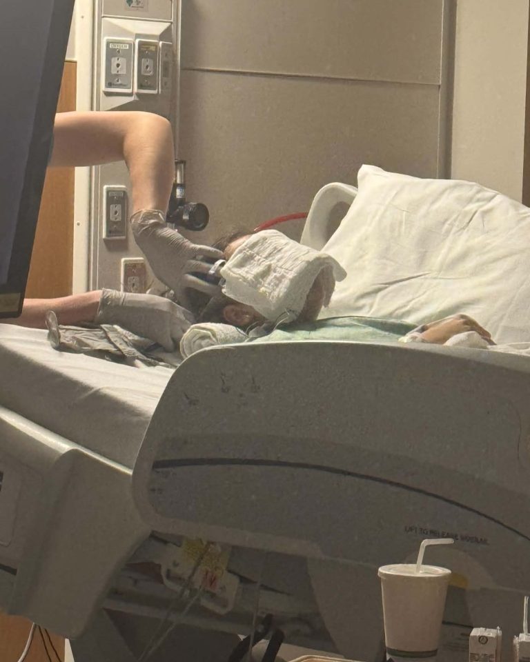 care team adding wires to genesis' head