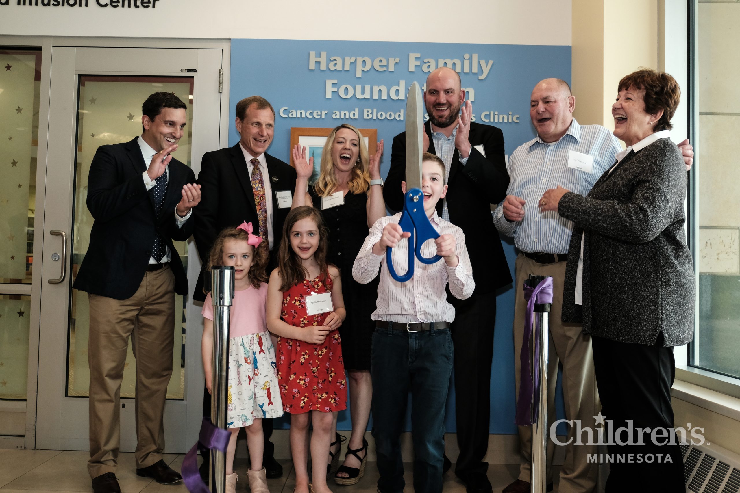 Cutting of the ribbon at the celebration of the official naming of the Harper Family Foundation Cancer and Blood Disorders Clinic.