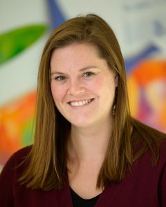 Cecily Wegmann smiles as she poses for a headshot.