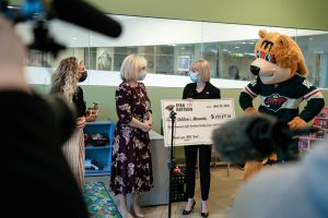 Wild Foundation team holding check