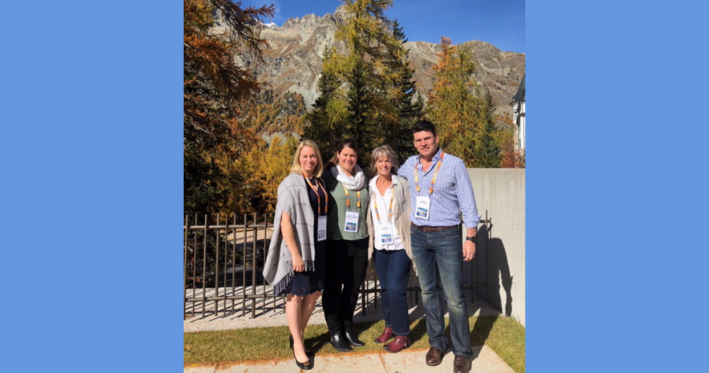 The team from Children's Minnesota and Midwest Fetal Care Center pose in front of a mountain in Switzerland