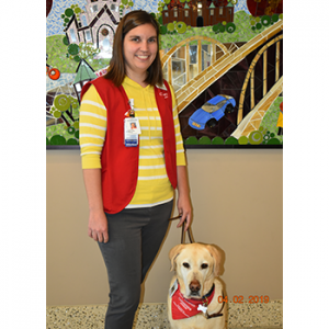 Courtney W., a volunteer with her dog Dillon