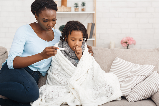 Mother takes her adolescent daughter's temperature