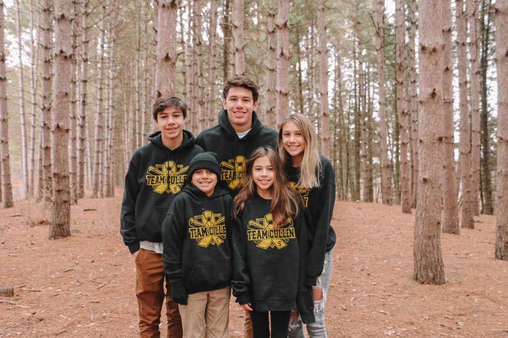 Cullen Cisneros and siblings in forest