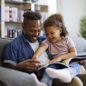 Dad and daughter reading together