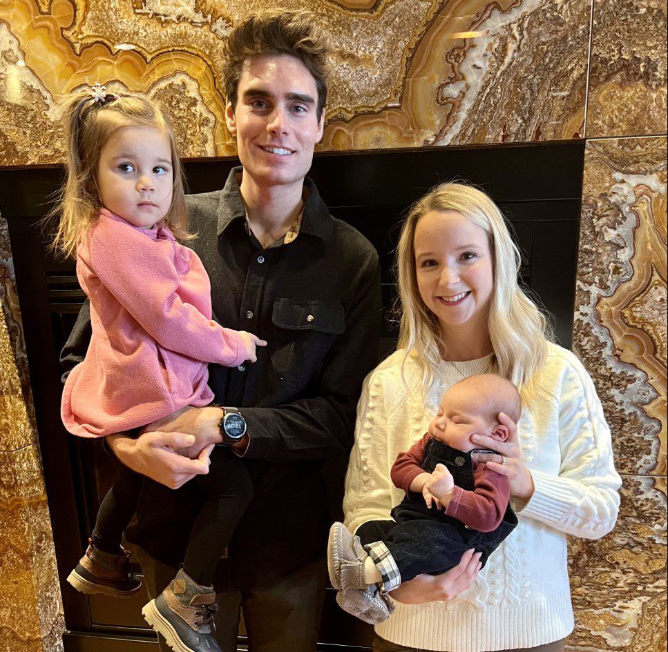 Parents, Joe and Rebecca, holding their children Delilah and William