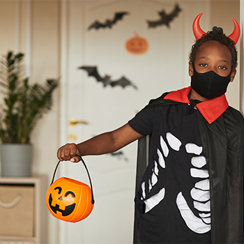 Child dressed as a devil for Halloween