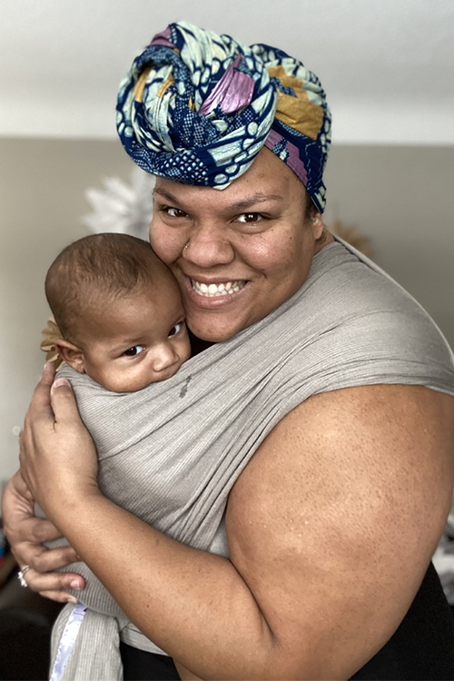 Kaytee babywearing her baby Kaytee babywearing her baby
